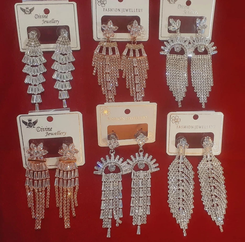 No 100.3 earring hanging.webp